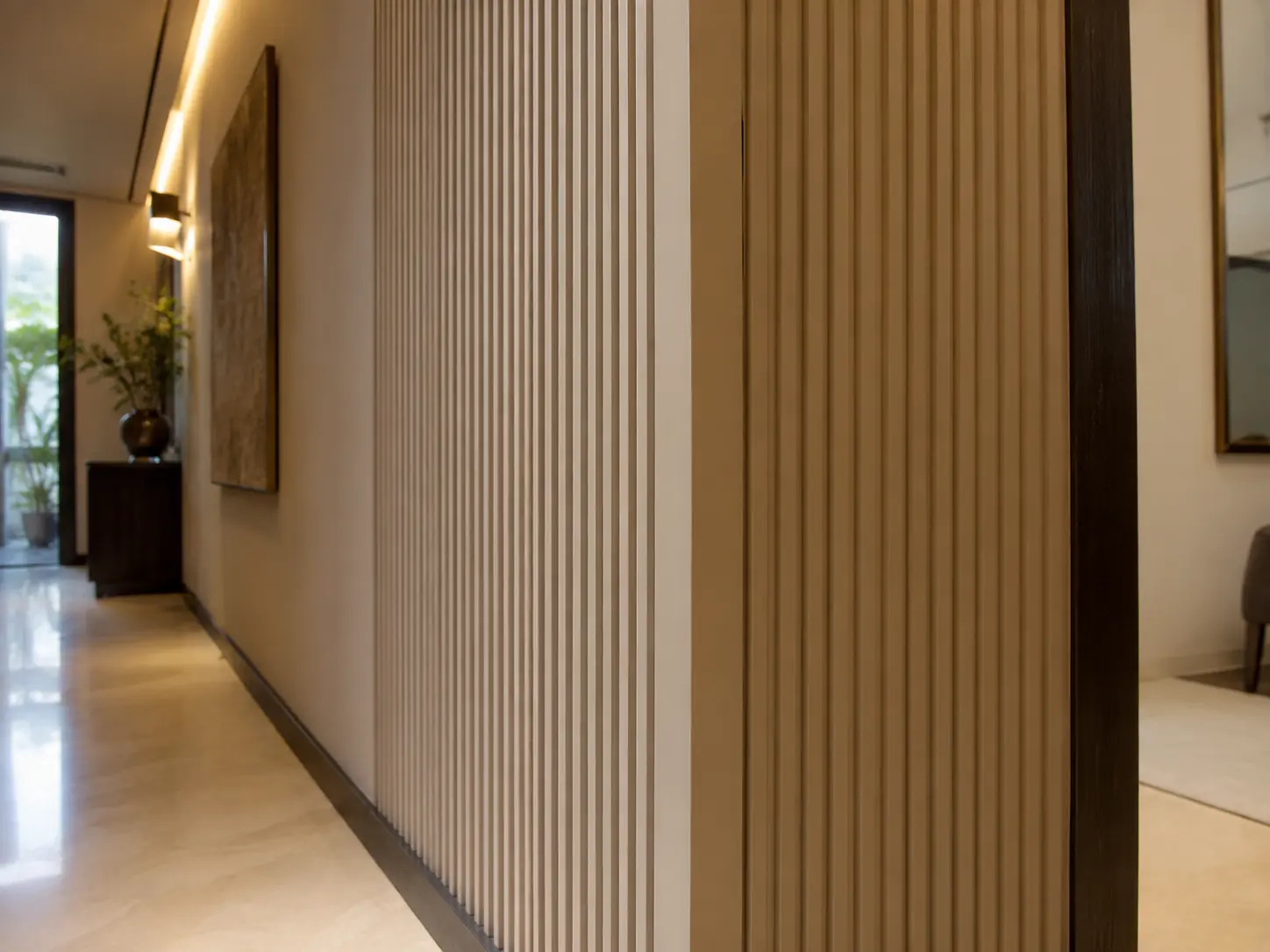 Adhesive application on the back of fluted wall panel before installation